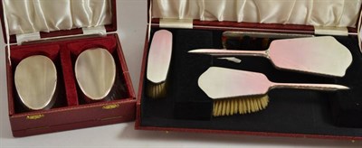 Lot 63 - A silver and enamel three piece dressing table set and a pair of silver clothes brushes