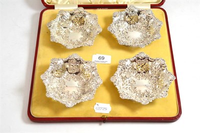 Lot 69 - A set of four Victorian pierced and repousse bonbon dishes, Birmingham 1901, in a fitted red...