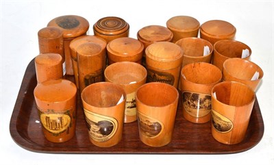 Lot 76 - A collection of Mauchline ware comprising: eight small tumblers and twelve various medicine...