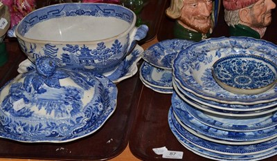 Lot 87 - Two trays of 19th century blue and white ceramics including tureen and cover, soup plates and...