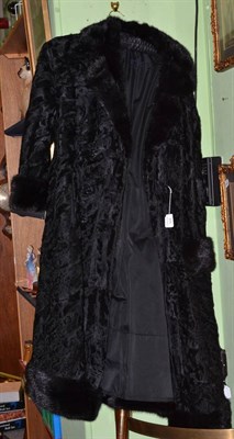Lot 111 - Herbert Duncan, London black astrakhan double breasted coat with black mink trimmed collar,...