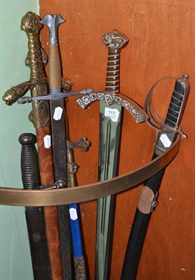 Lot 117 - Six various medieval style swords, an Indian sword, an African prestige staff and a brass...
