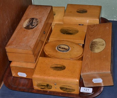 Lot 121 - A collection of Mauchline ware comprising: three glove boxes, a small tea caddy, an oval box...