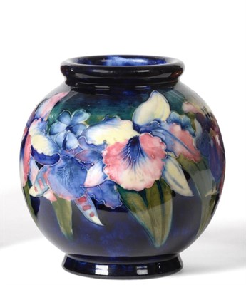 Lot 579 - Walter Moorcroft (British, 1917-2002): An Orchid and Spring Flowers Pattern Vase, on a...