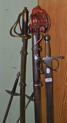 Lot 139 - A copy of a Scottish basket hilt sword, a copy of a Schiavona, a copy of a cavalry sword and...