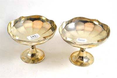Lot 143 - A pair of silver bonbon dishes