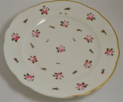 Lot 154 - A Nantgarw porcelain plate decorated with roses and a gilt border, impressed marks