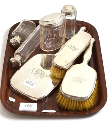 Lot 156 - A silver dressing table set, four silver mounted glass bottles