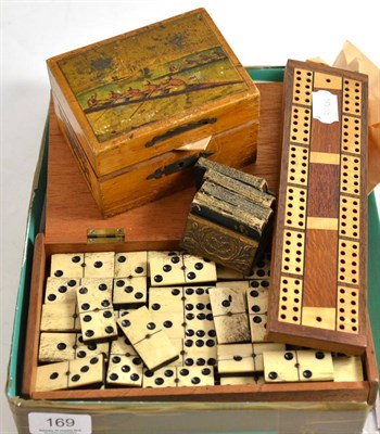 Lot 169 - Bone dominoes, coins, miniature book, crib board, money box