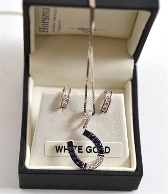 Lot 190 - A sapphire and diamond horseshoe pendant on chain and a pair of cubic zirconia set earrings