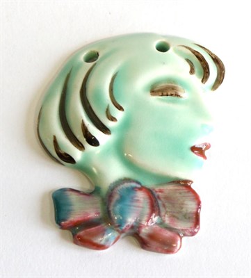 Lot 613 - Clarice Cliff (British, 1899-1972): A Pendant Wall Mask, modelled as the profile of a young...