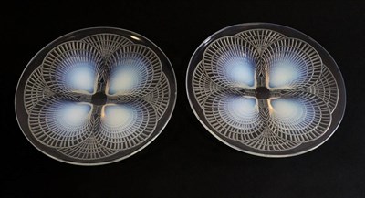 Lot 620 - René Lalique (French, 1860-1945): Two Opalescent and Clear Glass  Coquilles Plates, No.3011,...