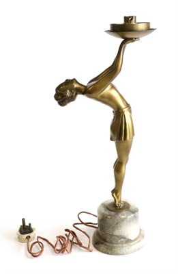 Lot 633 - An Art Deco Gilt Patinated Spelter Figural Lamp, modelled as a semi nude on tip toes, wearing a...