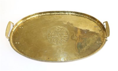 Lot 641 - Hugh Wallis of Altrincham (British, 1871-1943): An Arts & Crafts Brass Twin Handled Oval Tray, rope