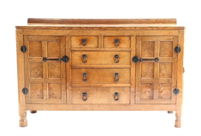 Lot 644 - Mouseman: A 1940s Robert Thompson English Oak 4ft 9in Panelled Sideboard, with raised upstand above