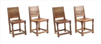 Lot 646 - Mouseman: A Set of Four 1940s Robert Thompson English Oak Dining Chairs, panel-backs and adzed...