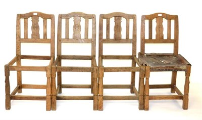 Lot 648 - Mouseman: Four 1933 Robert Thompson English Oak Chairs, with shaped top rails above slatted...