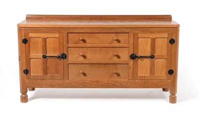 Lot 665 - Mouseman: A Robert Thompson Panelled English Oak 5ft Sideboard, with raised upstand, above...