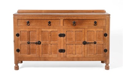 Lot 677 - Mouseman: A Robert Thompson Panelled English Oak 5ft Sideboard, with raised upstand, above two...