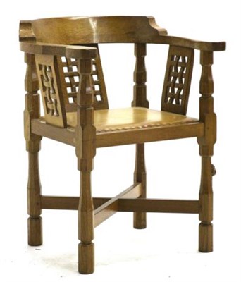 Lot 680 - Mouseman: A Robert Thompson Oak Monk's Chair, with curved back and shaped arms, over three...