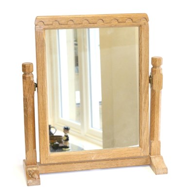 Lot 686 - Mouseman: A Robert Thompson English Oak Stand Mirror, the rectangular mirror pivots between two...