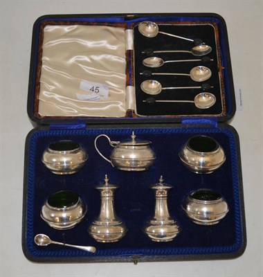 Lot 45 - A cased set of silver coffee spoons together with a cased silver condiment set