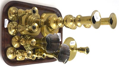Lot 60 - A group of 19th century brass candlesticks including a Heemskerk style candlestick