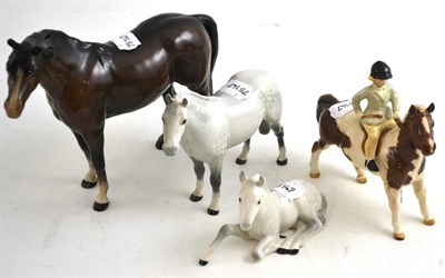 Lot 70 - Beswick girl on pony and three Beswick horses
