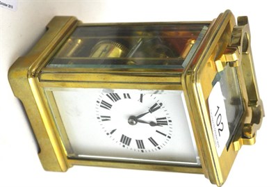 Lot 102 - A brass striking carriage clock