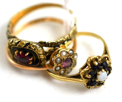 Lot 121 - A 9ct gold sapphire and opal ring, a 9ct gold ruby and seed pearl ring and another