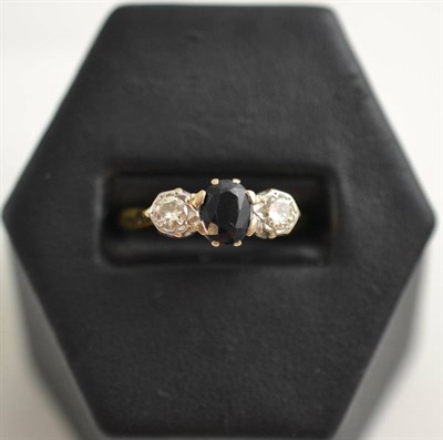 Lot 124 - A sapphire and diamond ring, stamped '18CT'