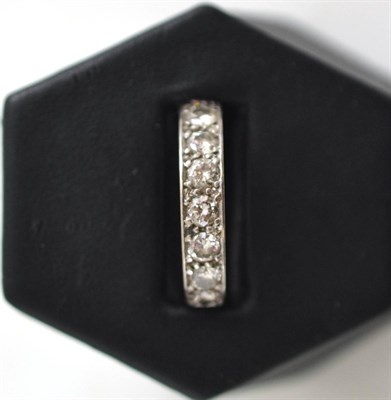 Lot 135 - An 18ct white gold and diamond half hoop eternity ring