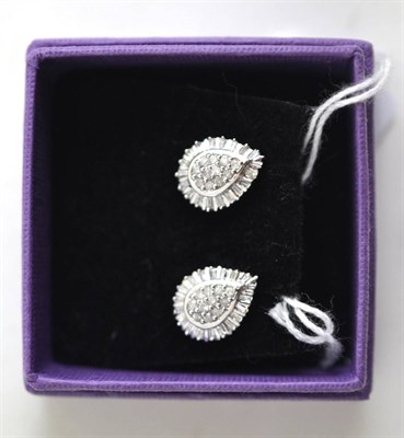 Lot 140 - A pair of diamond cluster earrings