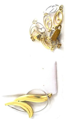Lot 148 - A 9ct gold two colour bracelet and a 9ct gold two colour brooch (2)