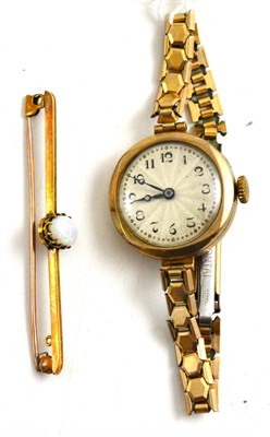 Lot 153 - A 9ct gold lady's wristwatch and an opal bar brooch stamped '15C'