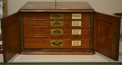 Lot 165 - An oak four-drawer cutlery canteen, containing an extensive flatware service