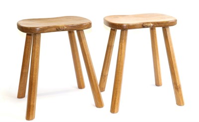 Lot 699 - Mouseman: Two Robert Thompson English Oak Cow Stools, on four octagonal legs, each with carved...