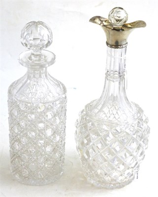 Lot 178 - A silver mounted double lipped decanter and a cylindrical cut glass decanter (2)