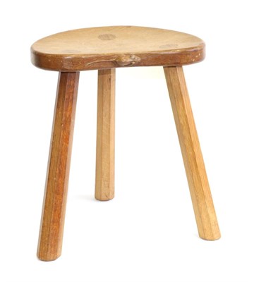 Lot 700 - Mouseman: A Robert Thompson English Oak Calf Stool, on three octagonal legs, with carved mouse...