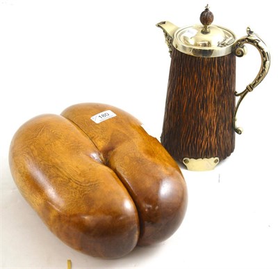 Lot 180 - A 19th century wooden jug with metal mounts and a Coco de Mer (2)