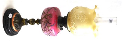 Lot 220 - A Victorian pink glass and enamel oil lamp