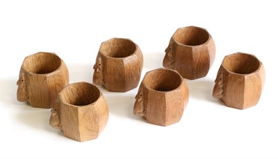 Lot 704 - Mouseman: Six Robert Thompson English Oak Napkin Rings, of octagonal form, each with carved...