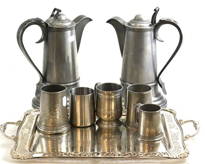 Lot 222 - A pair of modern pewter flagons together with four pewter tankards and a silver-plated tea tray...