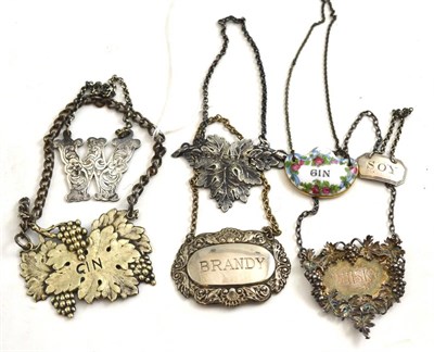 Lot 242 - A quantity of silver, plated and pottery decanter labels (7)