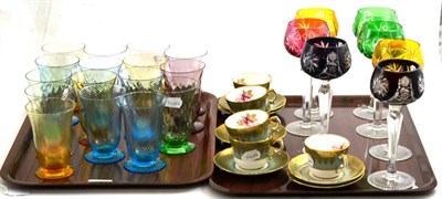 Lot 274 - A set of sixteen coloured glass tumblers, seven coloured hock glasses and six coffee cups and...