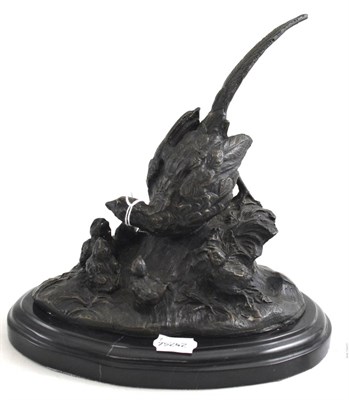 Lot 286 - A small bronze of a bird and chicks, on marble base