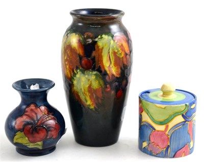 Lot 299 - A Moorcroft vase together with a small Moorcroft Anemone pattern vase and a Clarice Cliff...