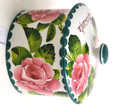 Lot 302 - A Wemyss jar and cover, 'Biscuits', Rose pattern, 11cm high