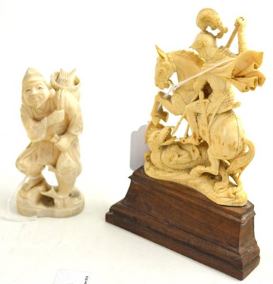 Lot 309 - A 19th century Japanese carved ivory figure of a fisherman and another of St George and the...