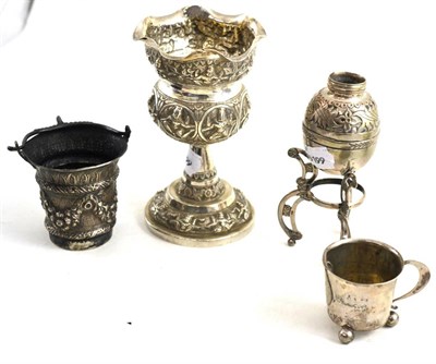 Lot 310 - Continental and Asian silver - a goblet, vase on tripod stand, a small embossed basket with...